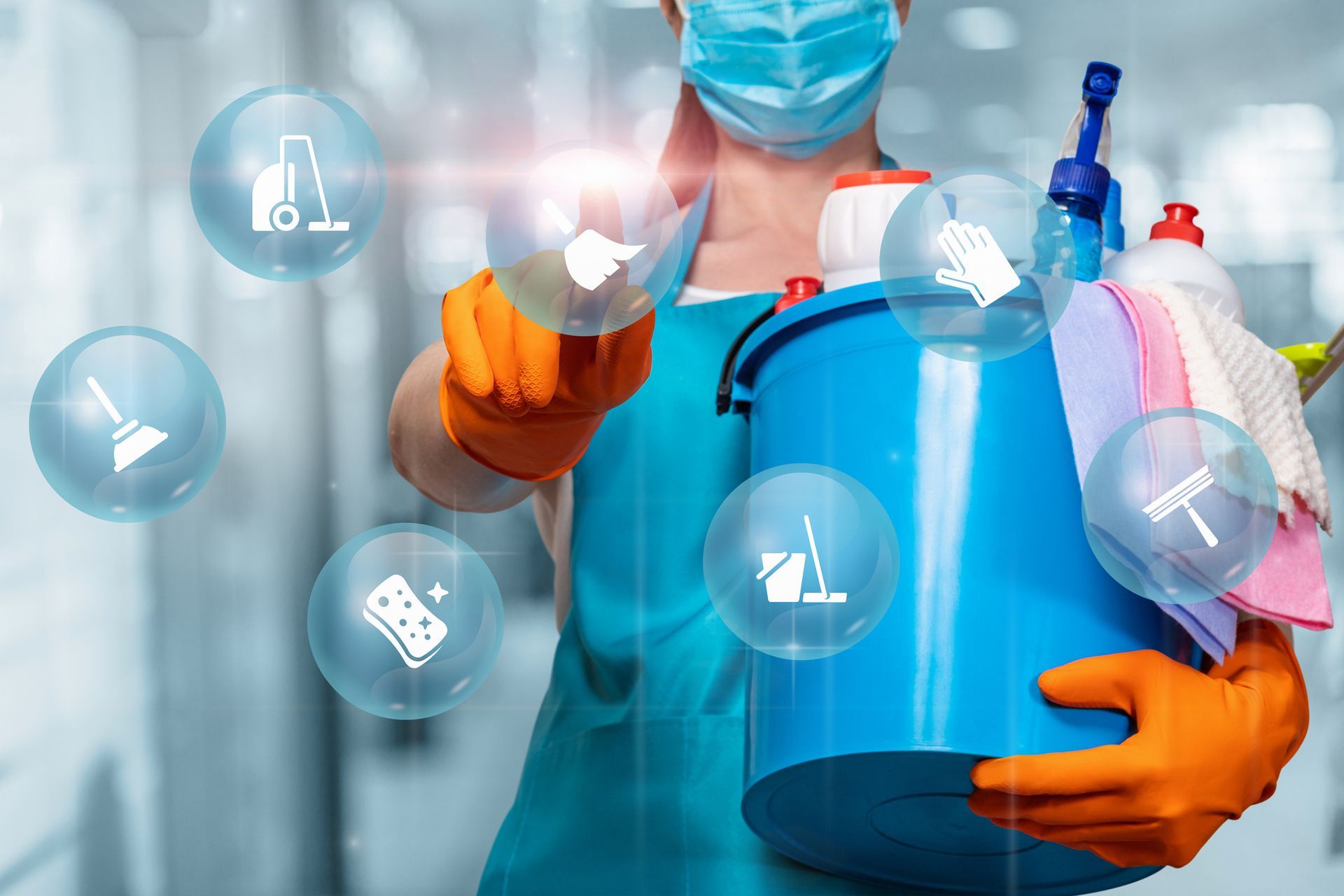 A cleaner wearing a mask and gloves is holding a bucket of cleaning supplies. A cleaner wearing a mask and gloves is holding a bucket of cleaning supplies.