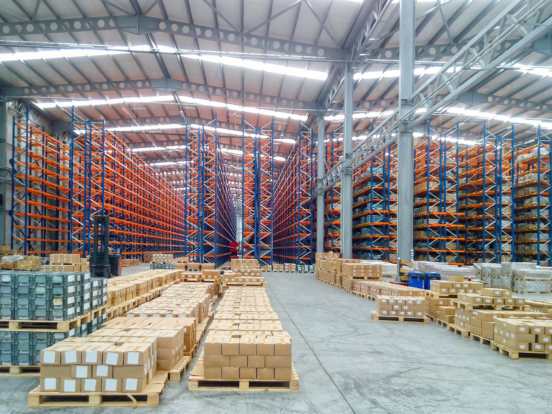 A large warehouse filled with lots of boxes and shelves A large warehouse filled with lots of boxes and shelves