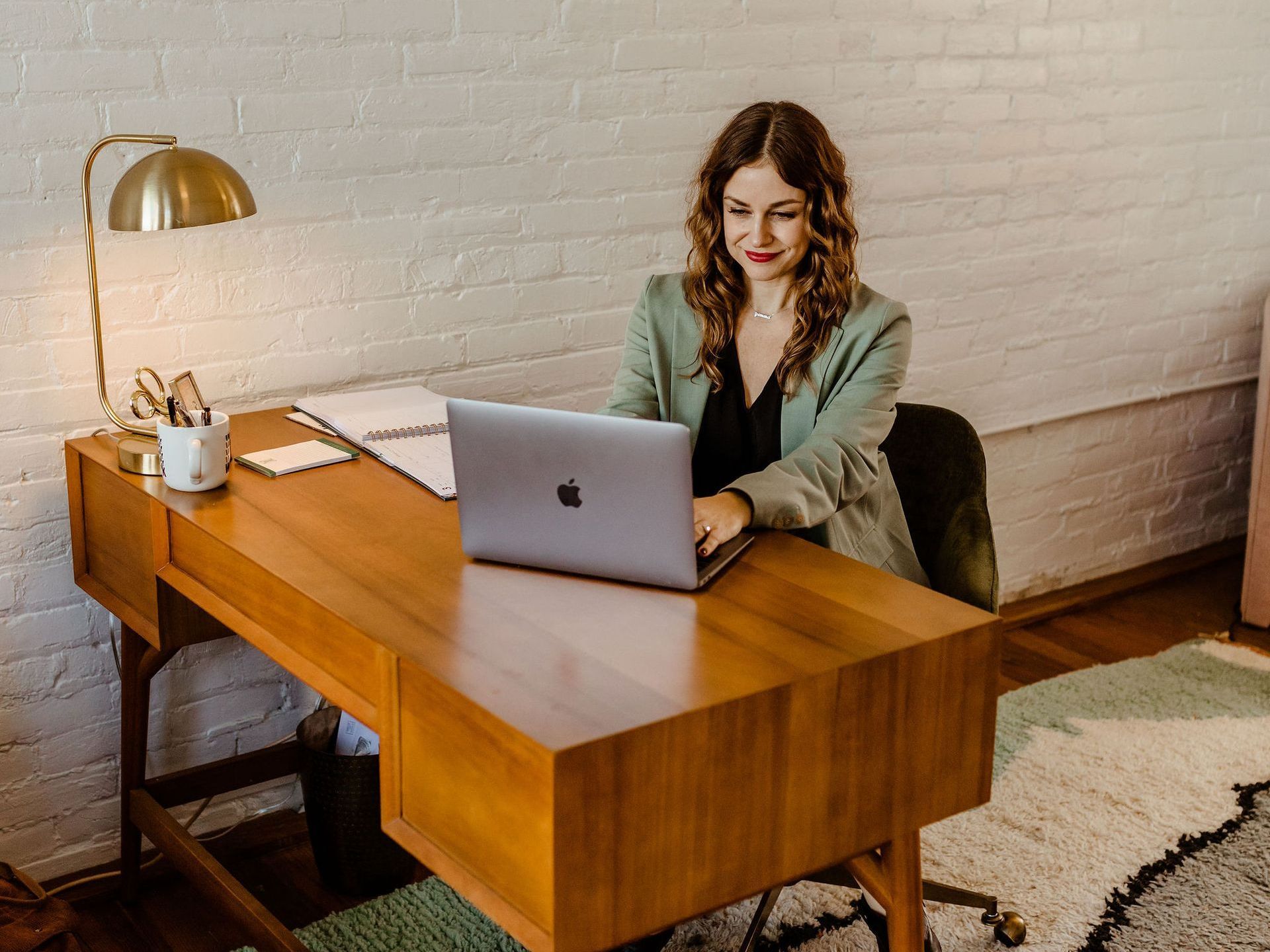 khristi dixon realtor sitting at desk in 4th street office