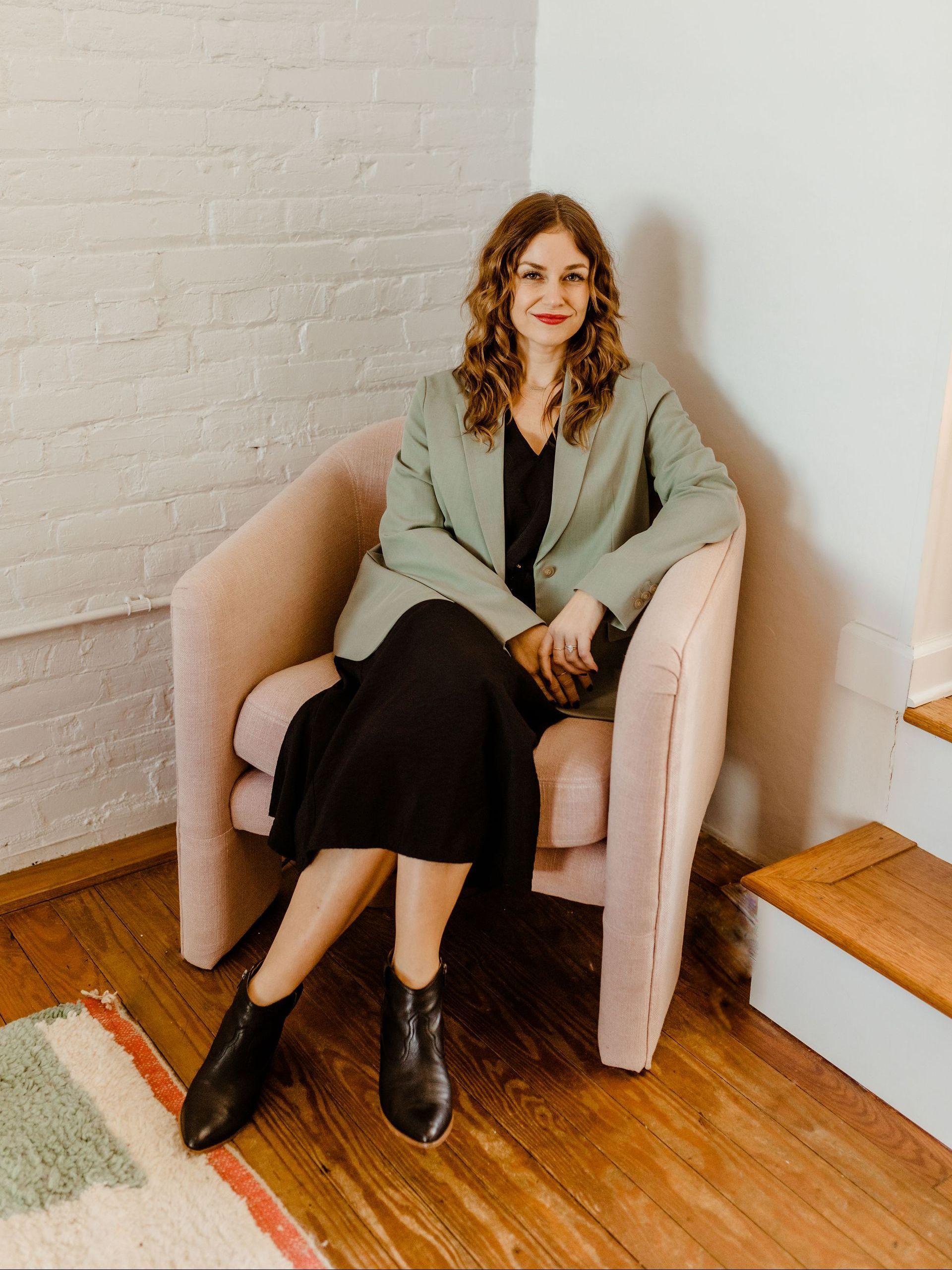 khristi dixon sitting in a chair at her realty office