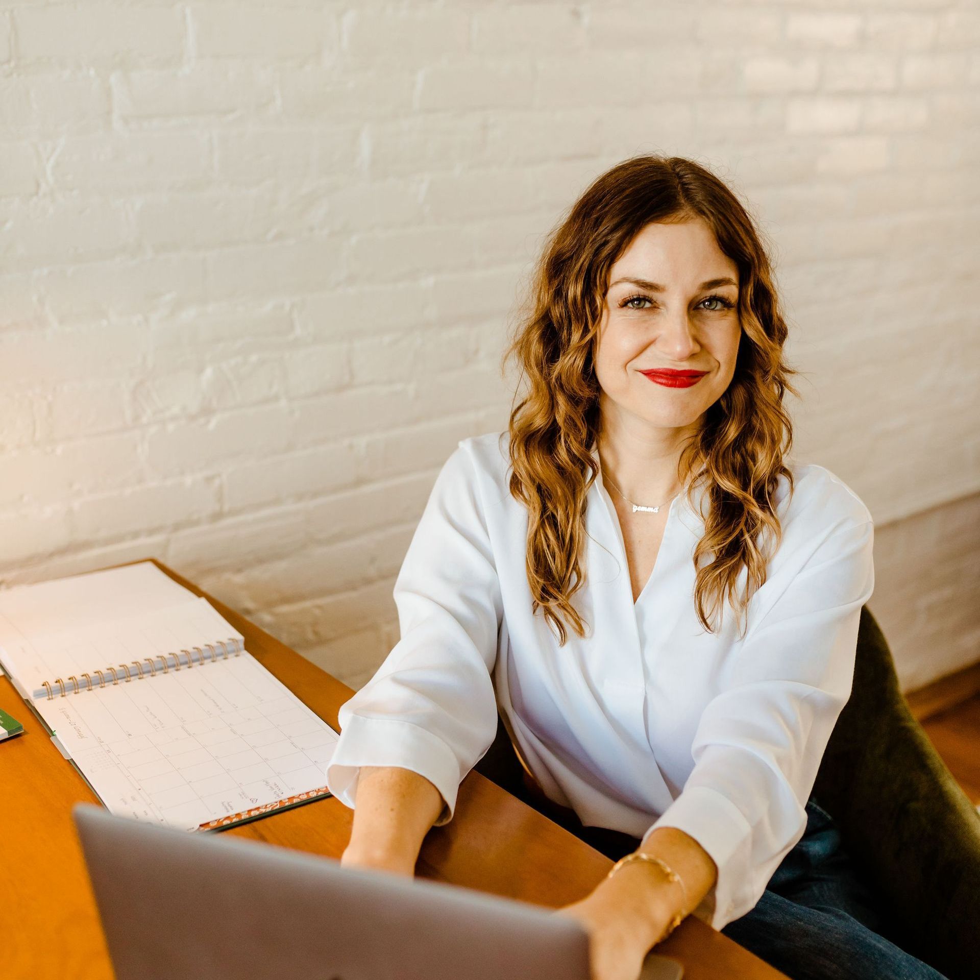 khristi dixon, realtor, sitting at desk