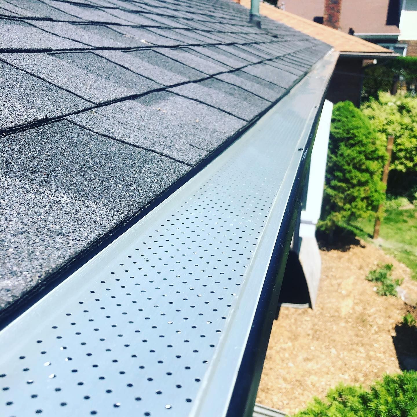 A close up of a gutter on a roof