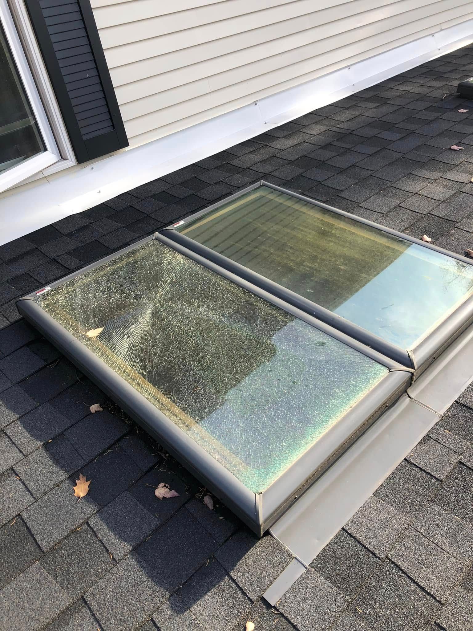 A skylight is sitting on the roof of a house