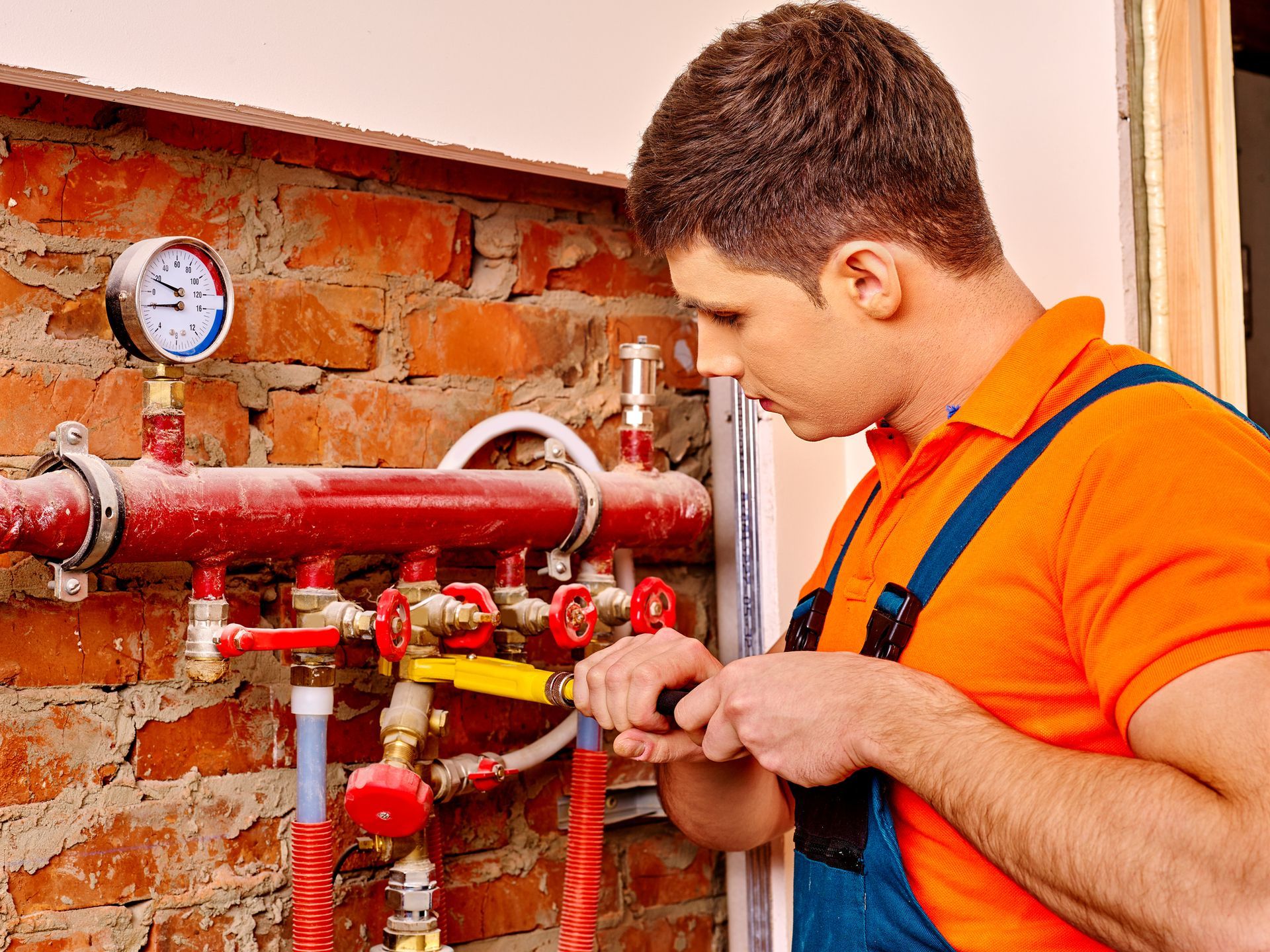 Comfort Tech Heating & Air Conditioning technician performing heating system maintenance in High Poi