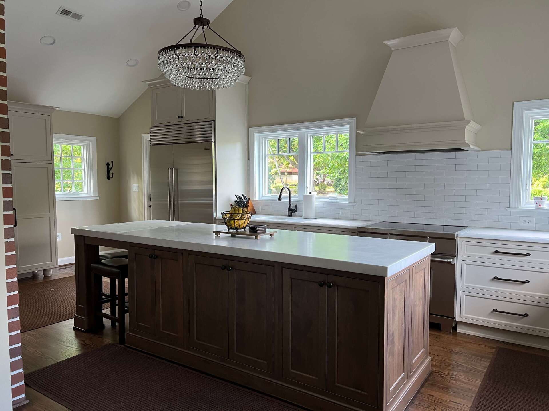 There is a large island in the middle of the kitchen.