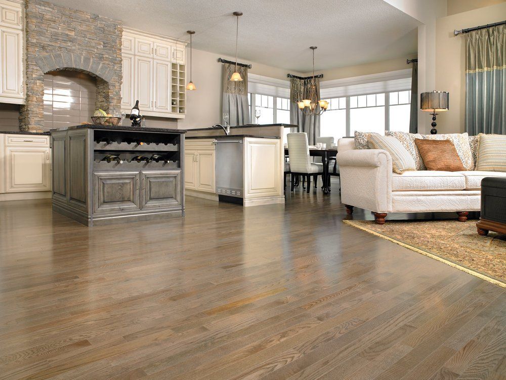 A living room with hardwood floors and a couch