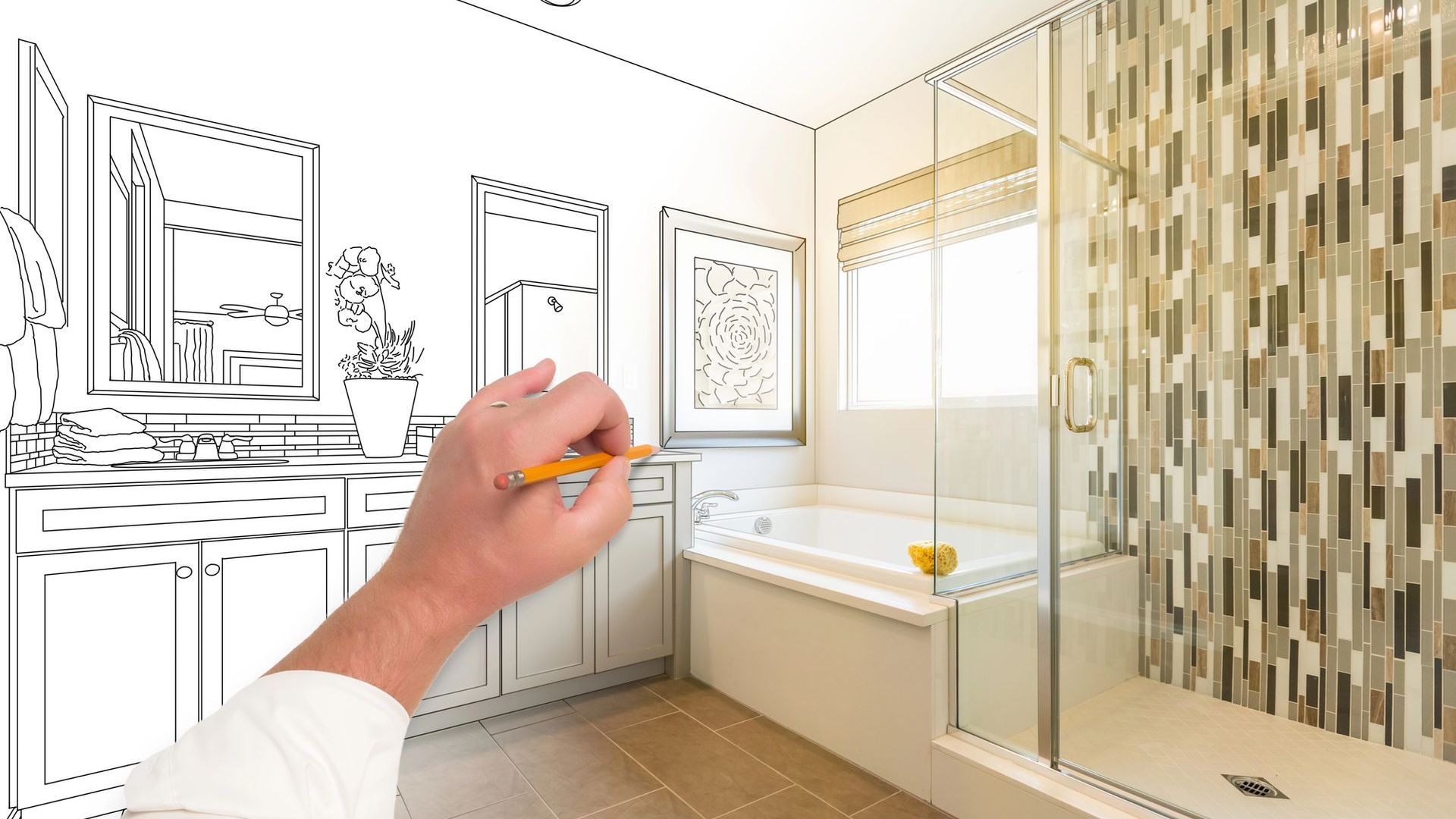 A person is drawing a bathroom with a pencil.