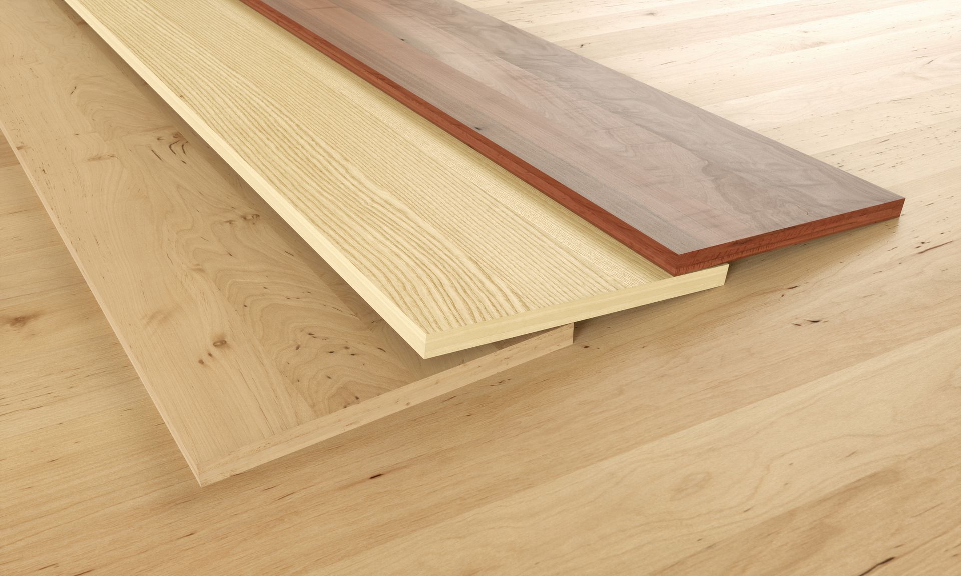 Three different types of wood are stacked on top of each other on a wooden floor.