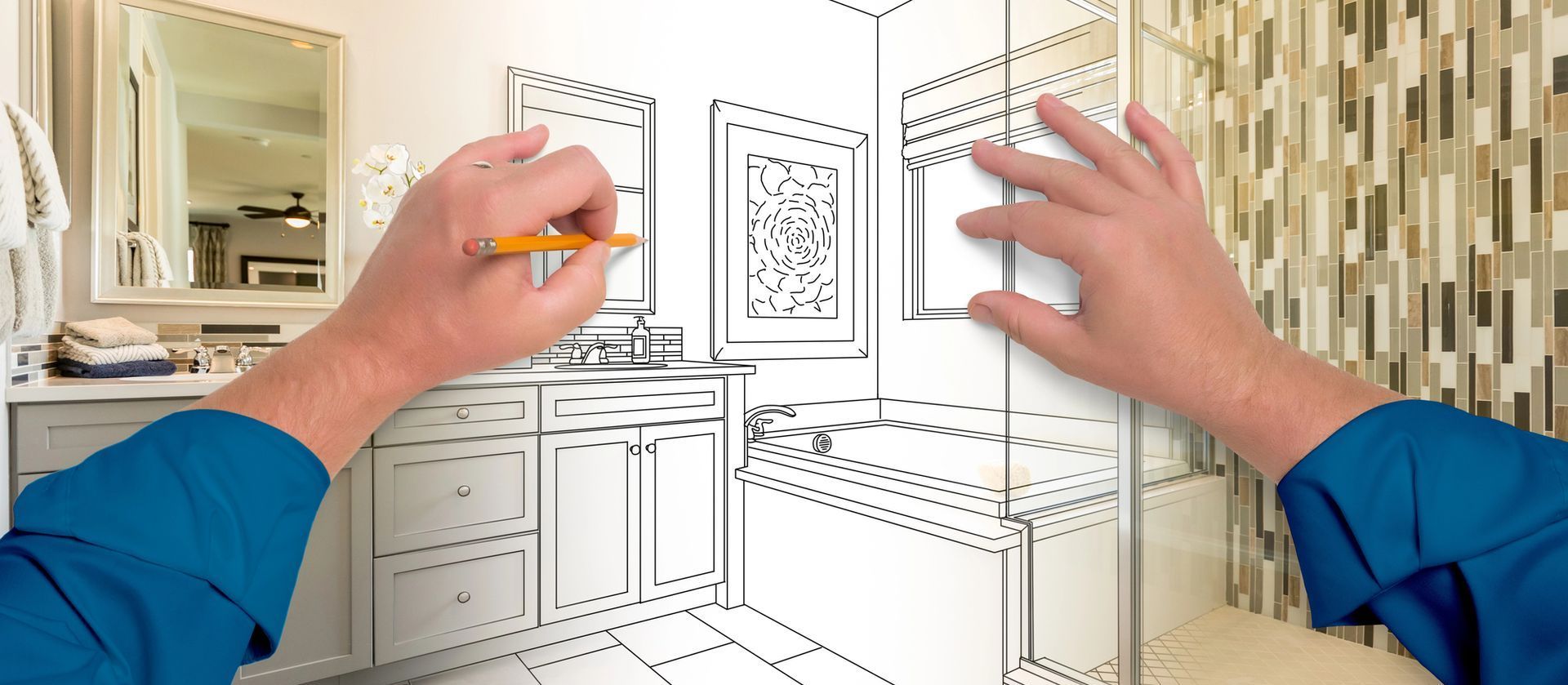 A person is drawing a bathroom with a pencil.