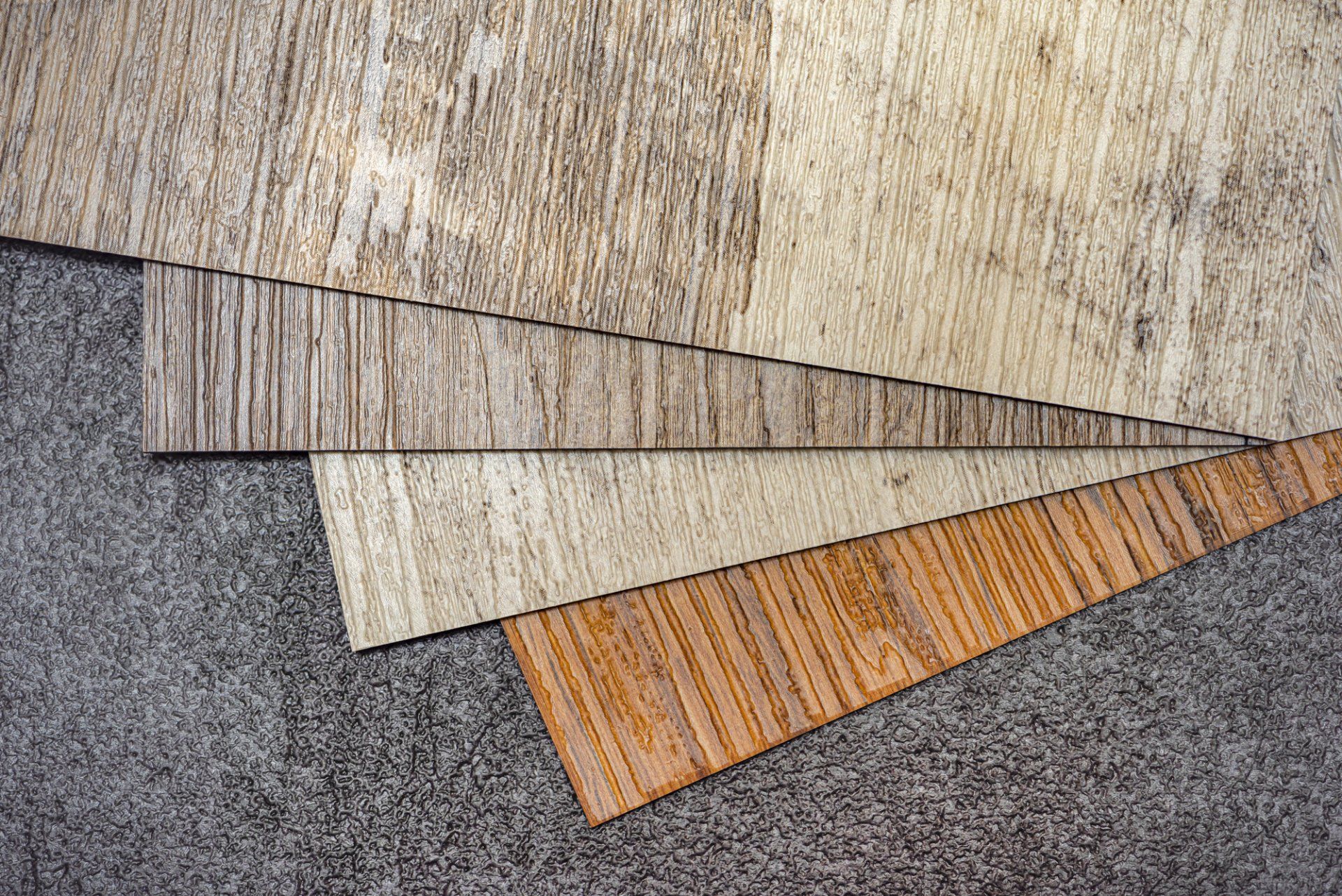 A stack of wooden boards sitting on top of a carpet.