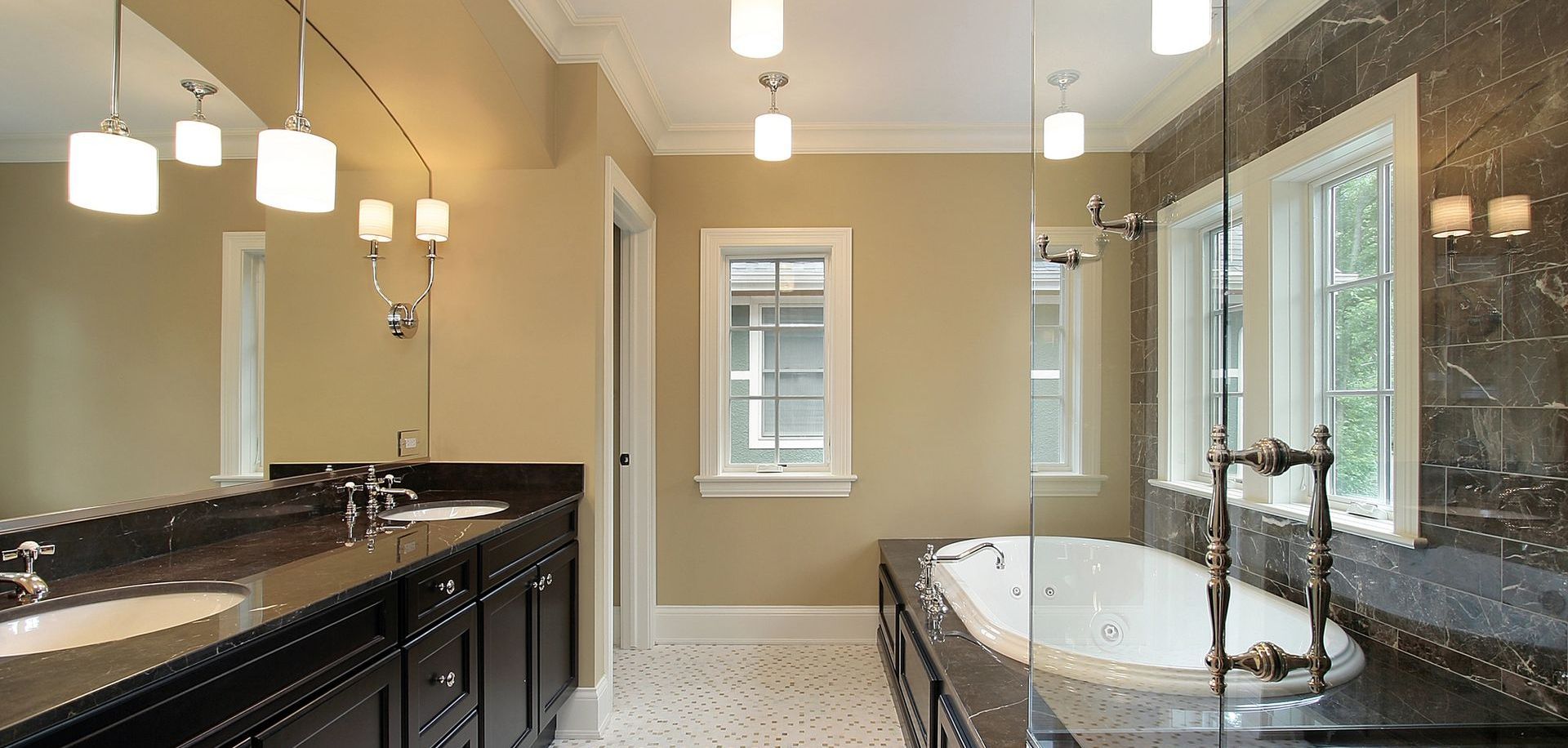 A bathroom with two sinks and a bathtub