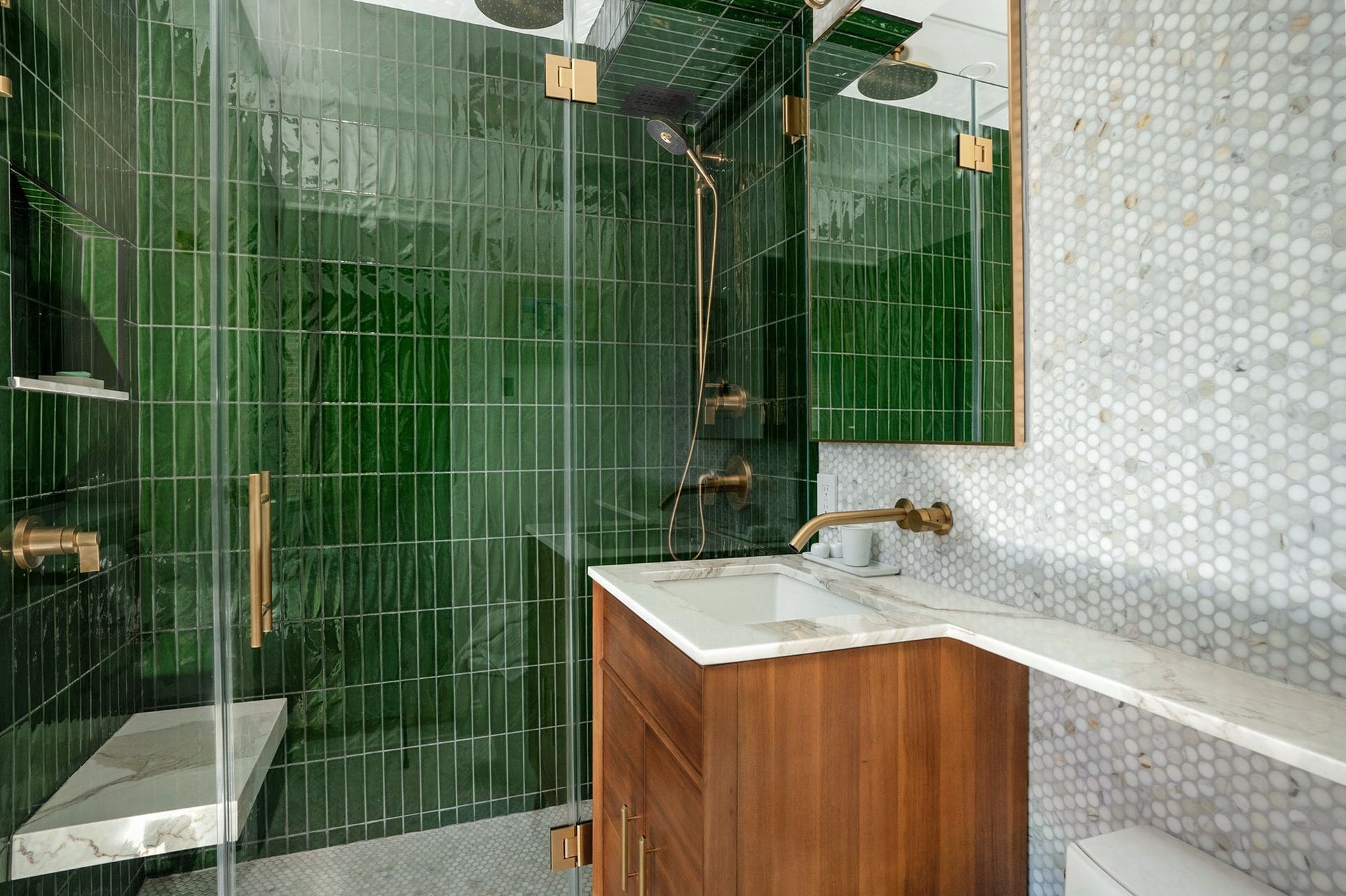 A bathroom with two sinks , two mirrors and a bathtub.