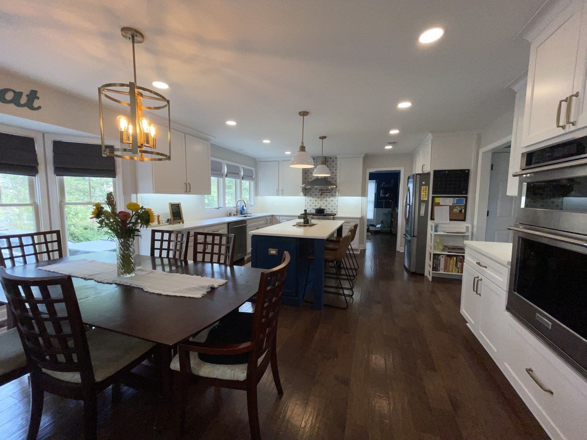 A kitchen with a table and chairs in it