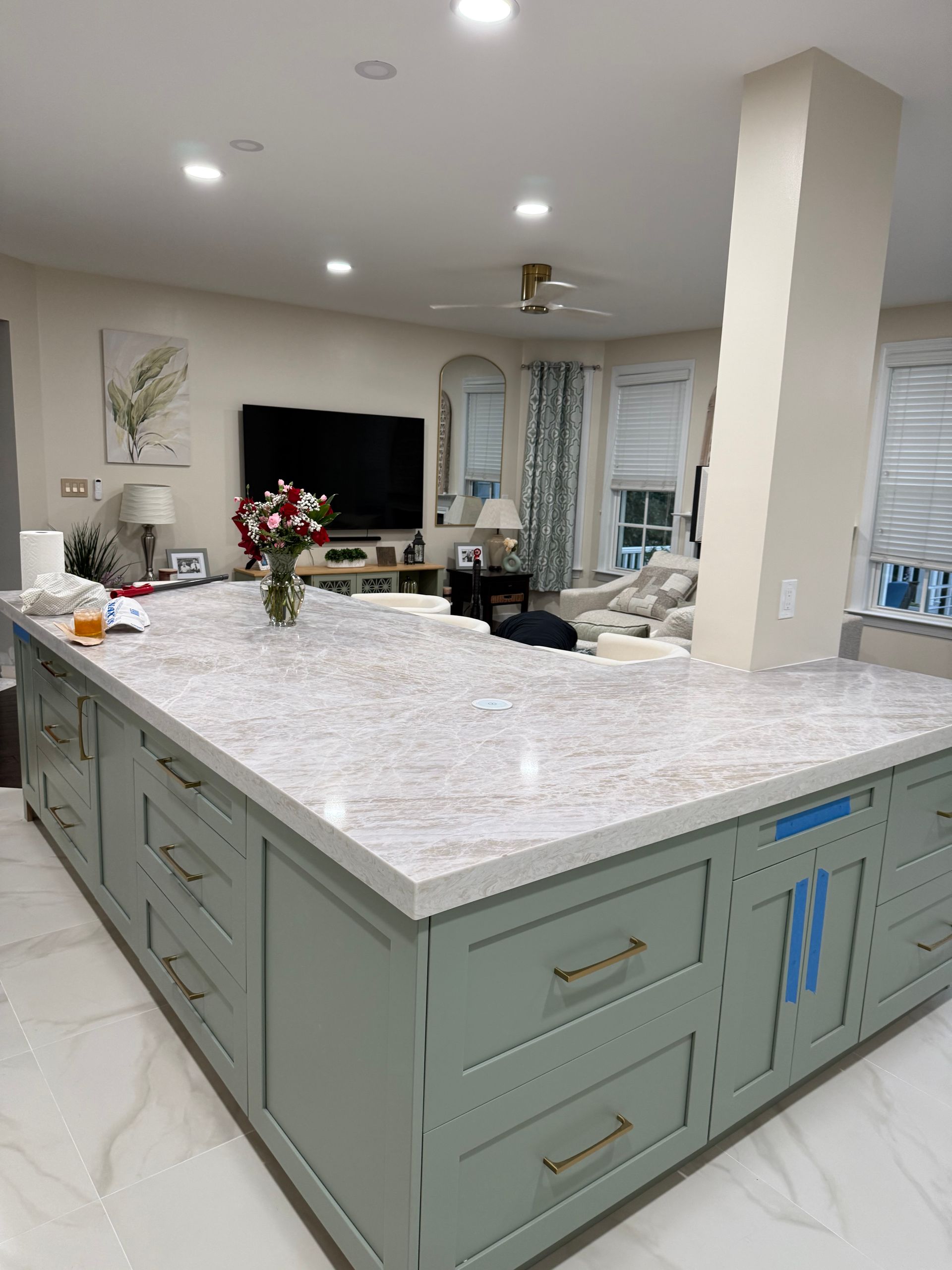 A kitchen and dining room in a house with a table and chairs