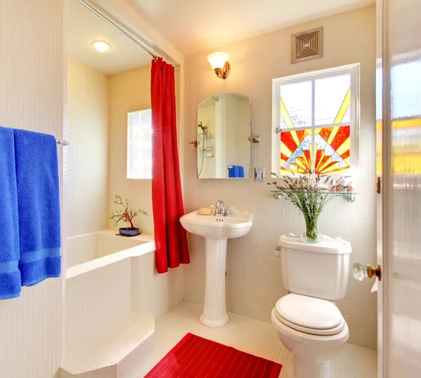 A bathroom with a sink toilet and bathtub