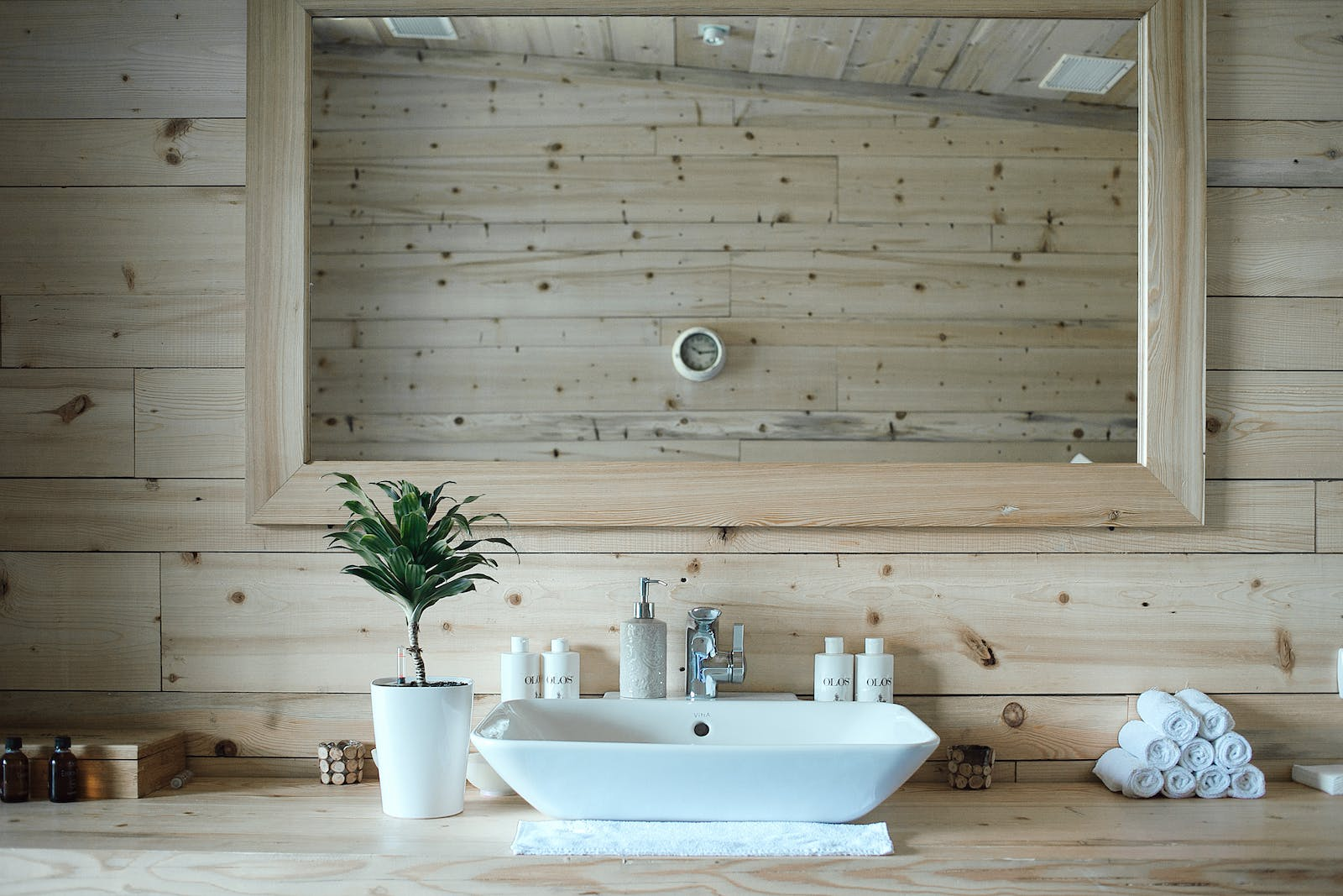 A bathroom with a sink and a mirror on the wall.