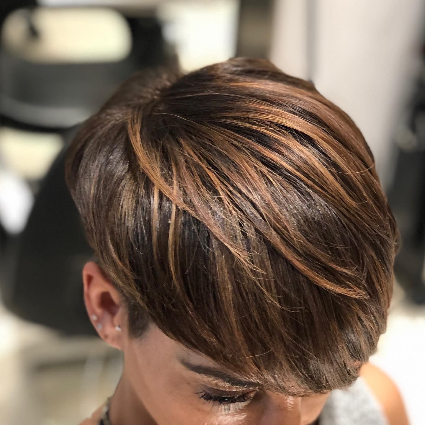 Close-up of a short layered brown-and-blonde hairstyle