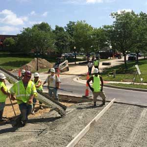 Asphalt services in Kansas City MO heavy equipment asphalt installation project by KCCAS Contractors