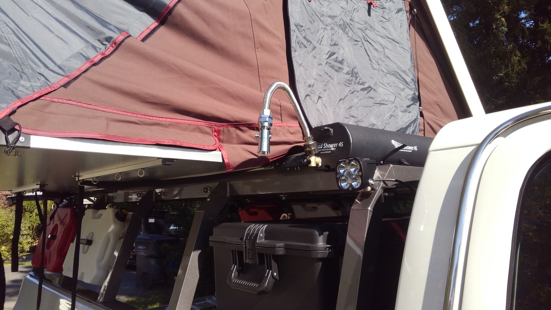 Overlanding made easier with a reliable road shower, offering comfort and cleanliness on the go.