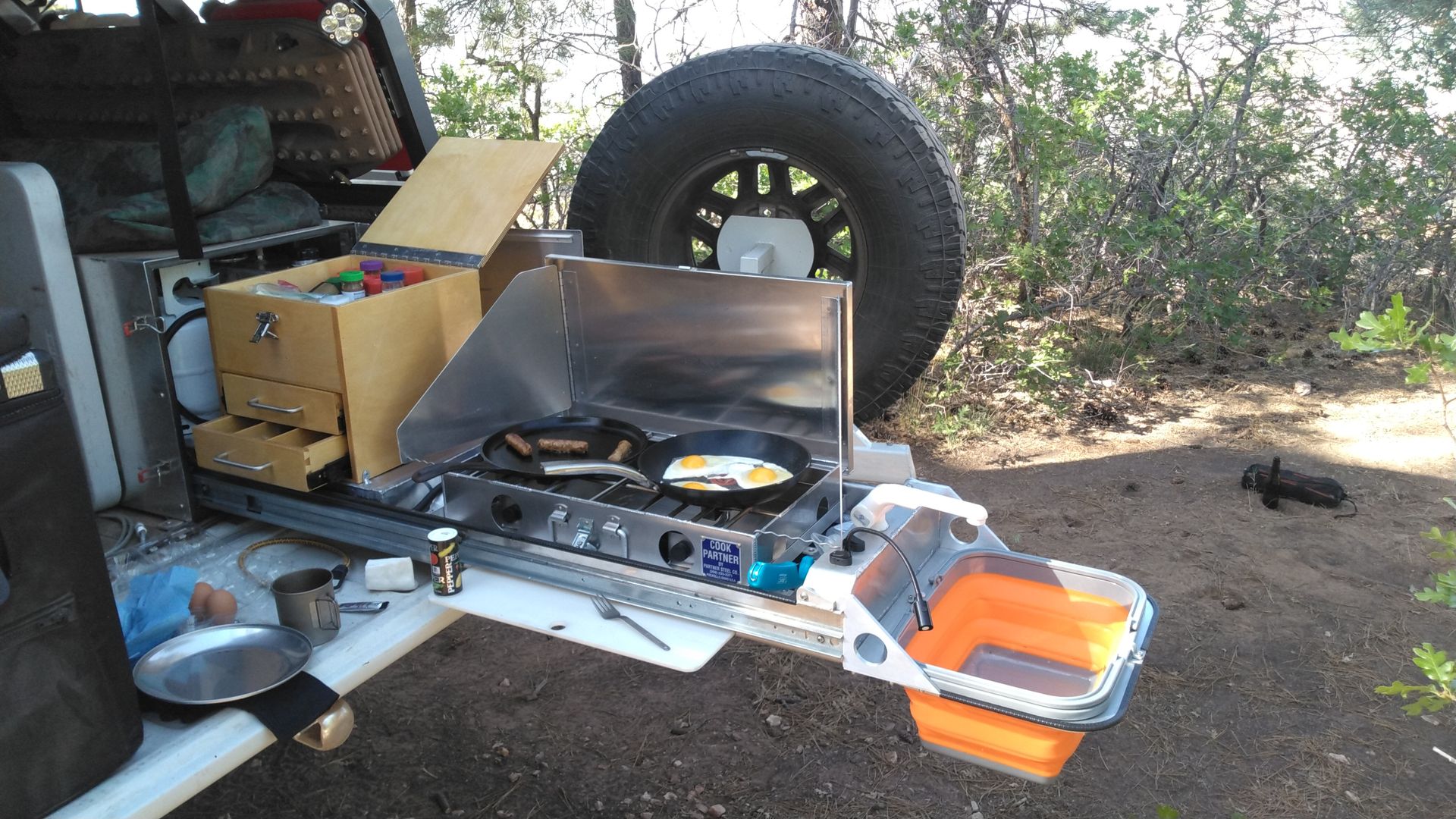 Compact slide-out kitchen for trucks, enhancing overlanding and camping experiences