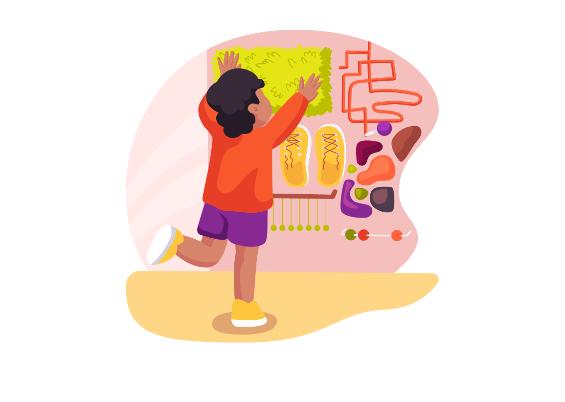 A young boy is playing with a maze on a wall.