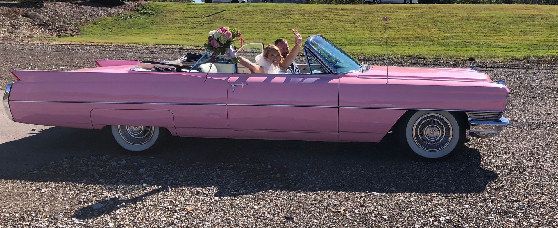 pink vintage getaway car at wedding