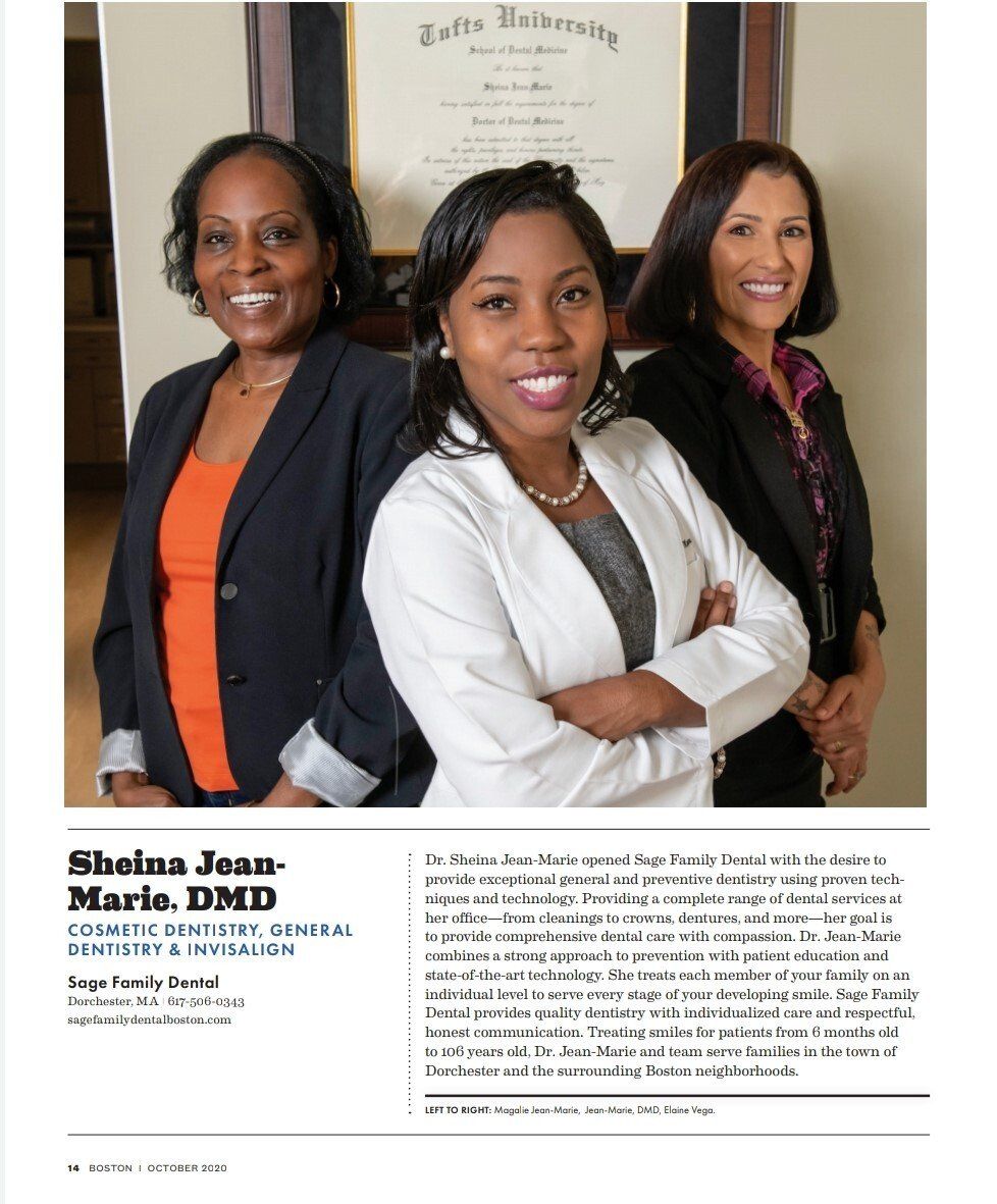 Three women are standing next to each other with their arms crossed.