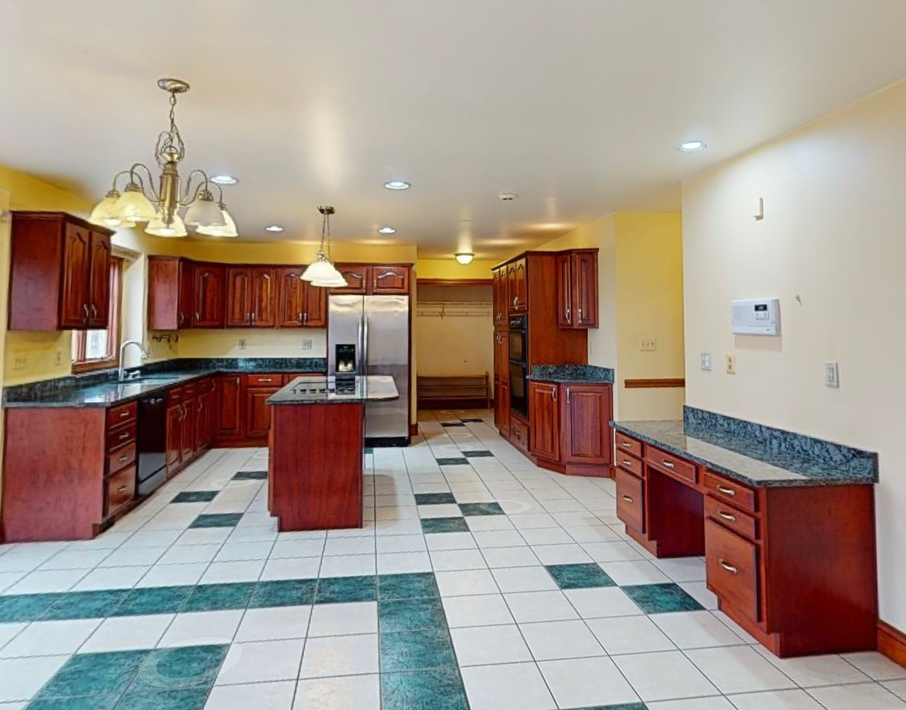 Outdated kitchen with standard-height cabinets, no crown molding, closed upper cabinets, and older finishes before remodel in Finksburg