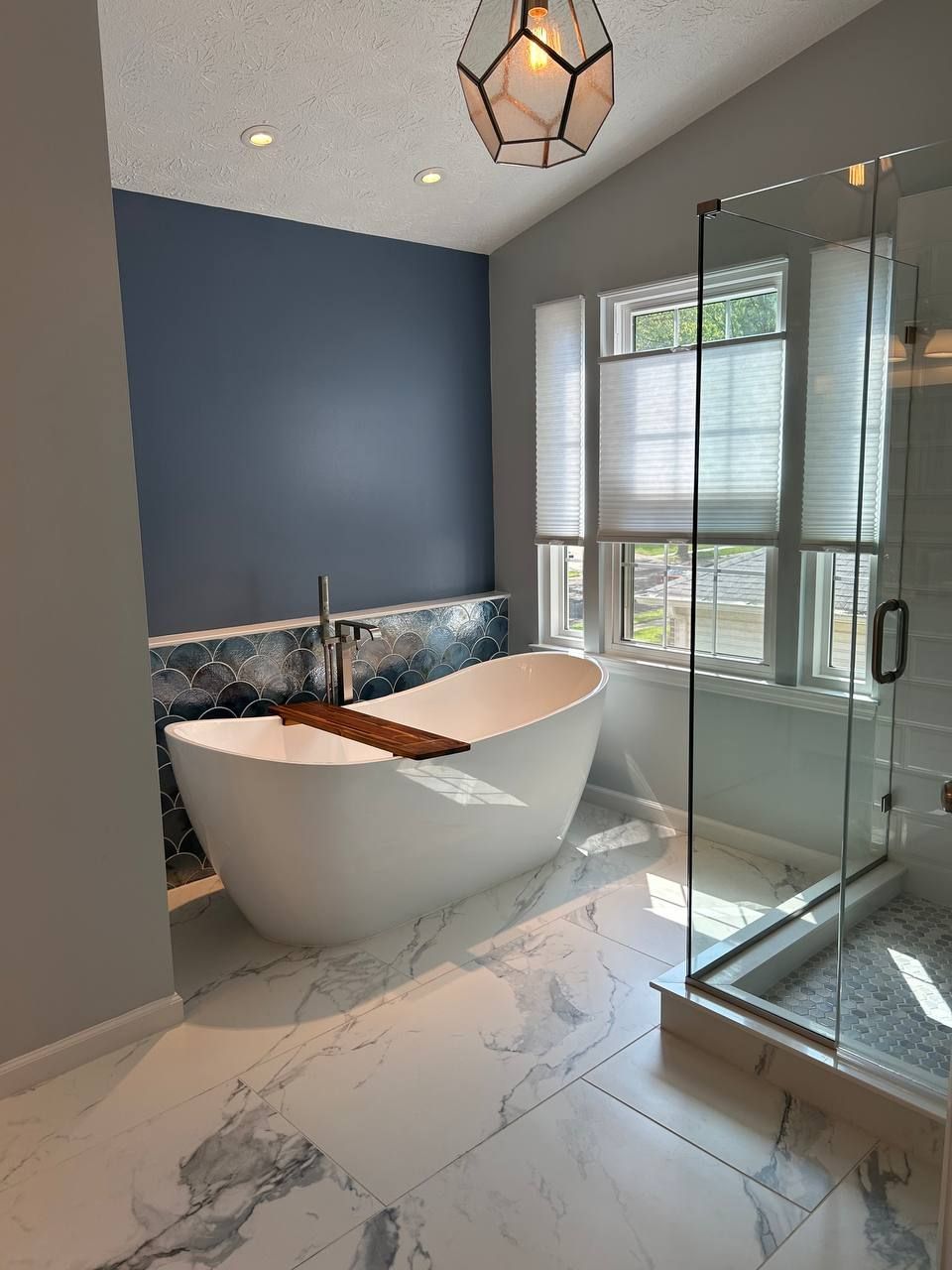Freestanding Tub with Accent Tile Wall and Modern Fixtures in Finksburg Master Bathroom