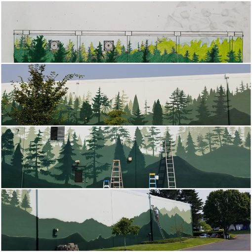 Person spray-painting a colorful mural with a large face on a wall