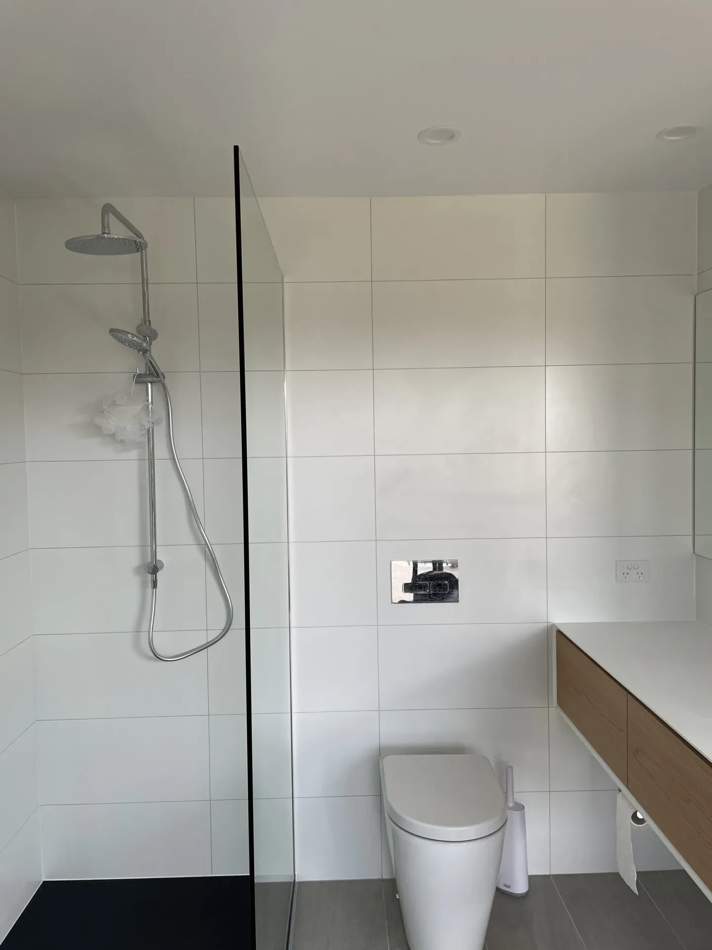 A Row of Minimalist Concrete Sinks With Metal Faucets in a Modern