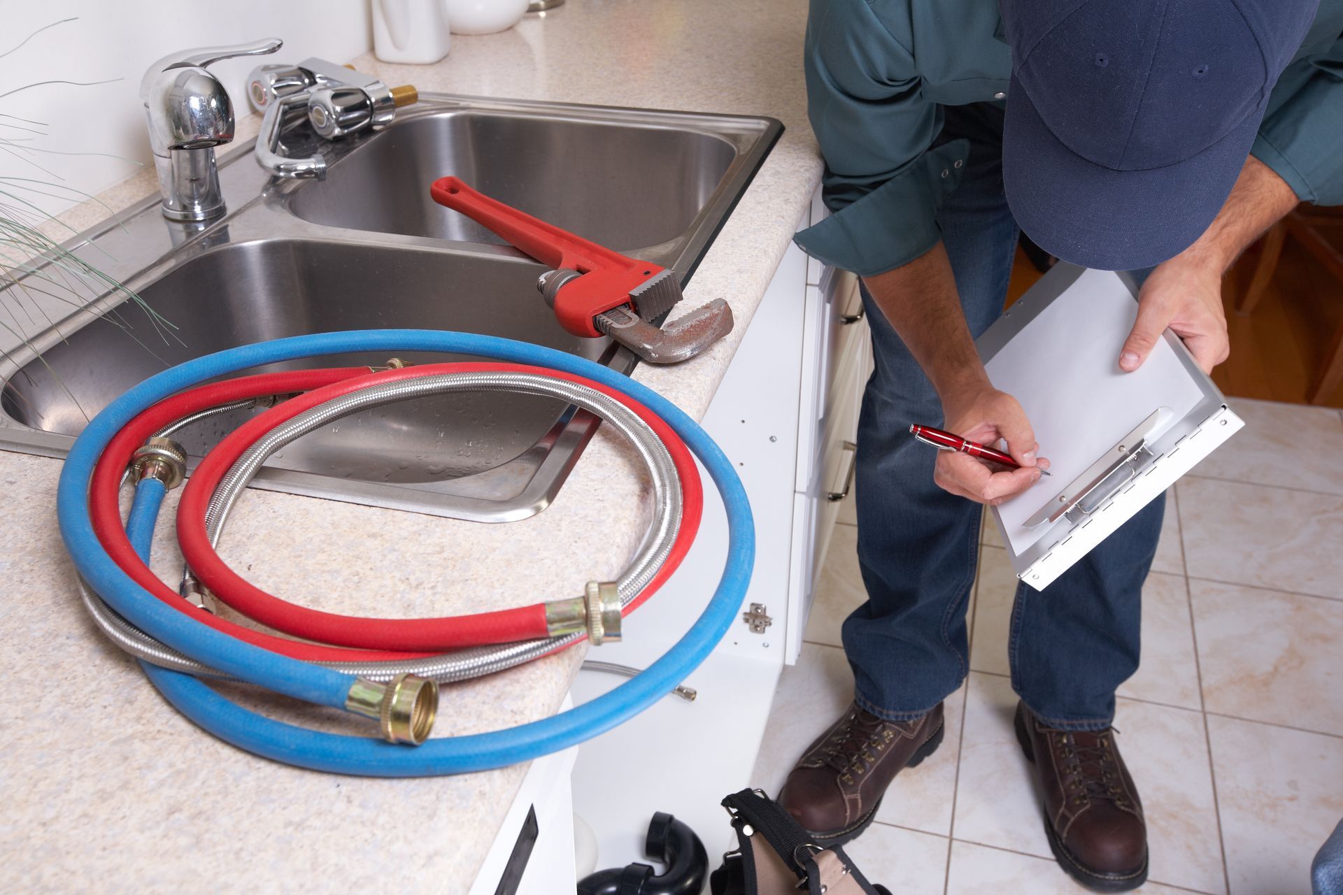 Plumber assessing a system for repiping.