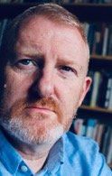 Photo of Mark Robinson - 50something white man with greying ginger hair and a beard.