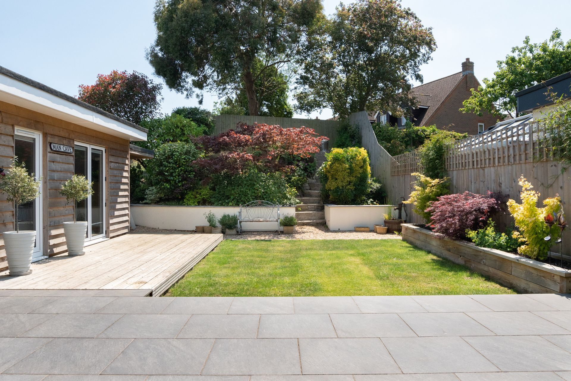 A house with a large lawn in front of it