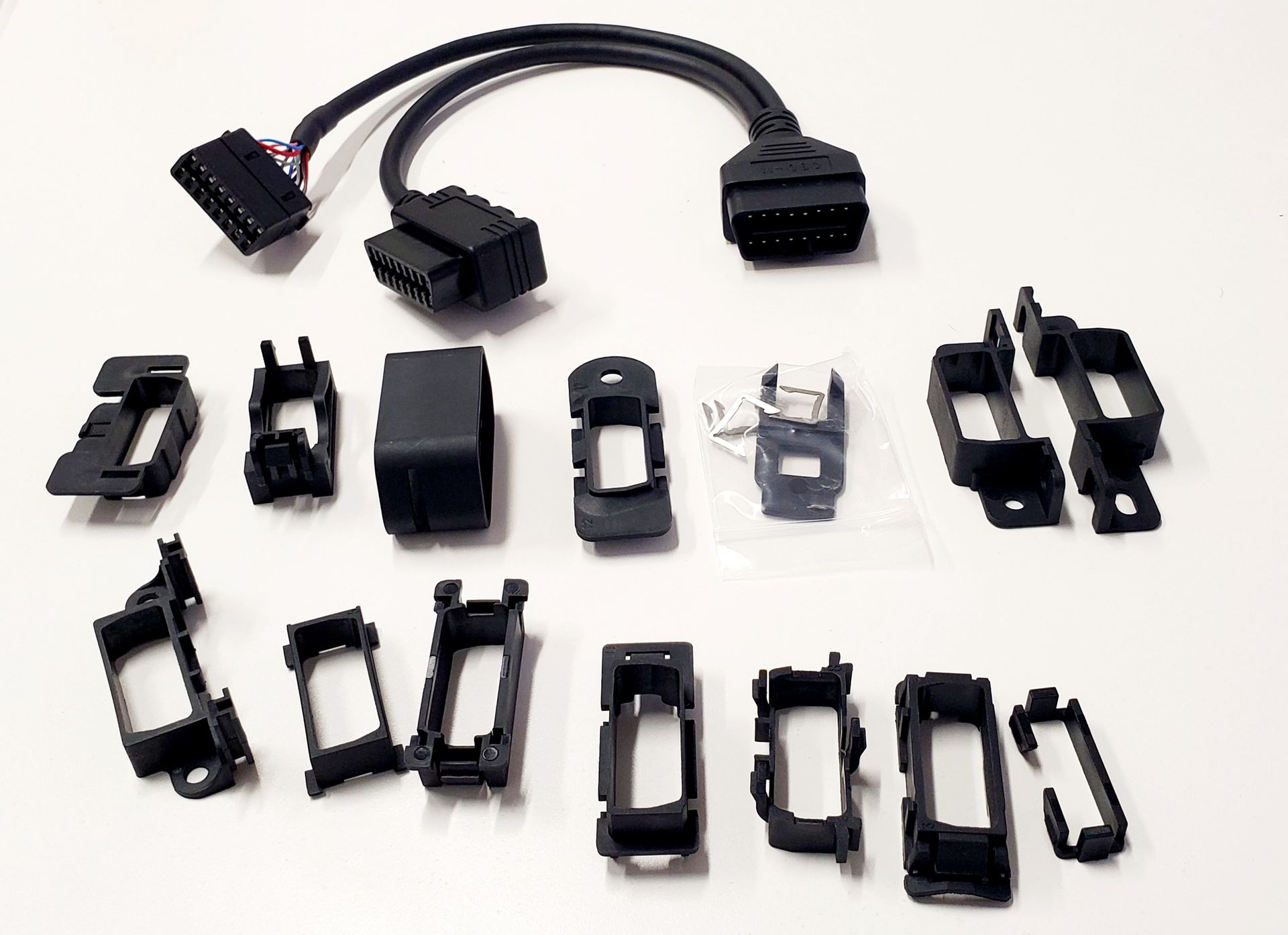 A bunch of different types of connectors are sitting on a table.
