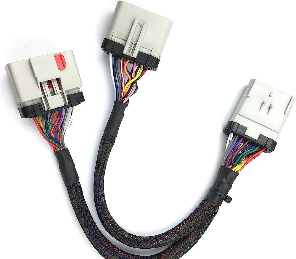 A bunch of wires are connected to each other on a white surface.
