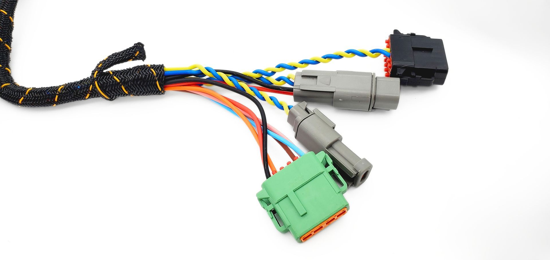 Wiring harness with multicolored cables and green, gray, and black connectors on a white background