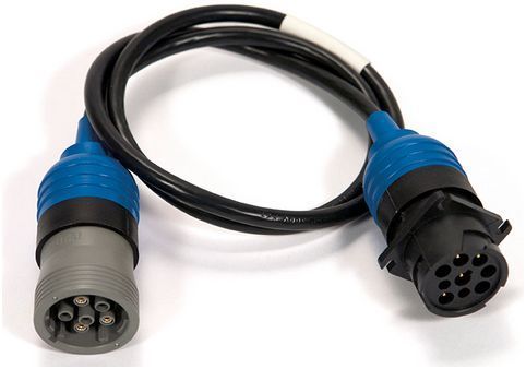 A close up of a cable with two connectors on a white surface.