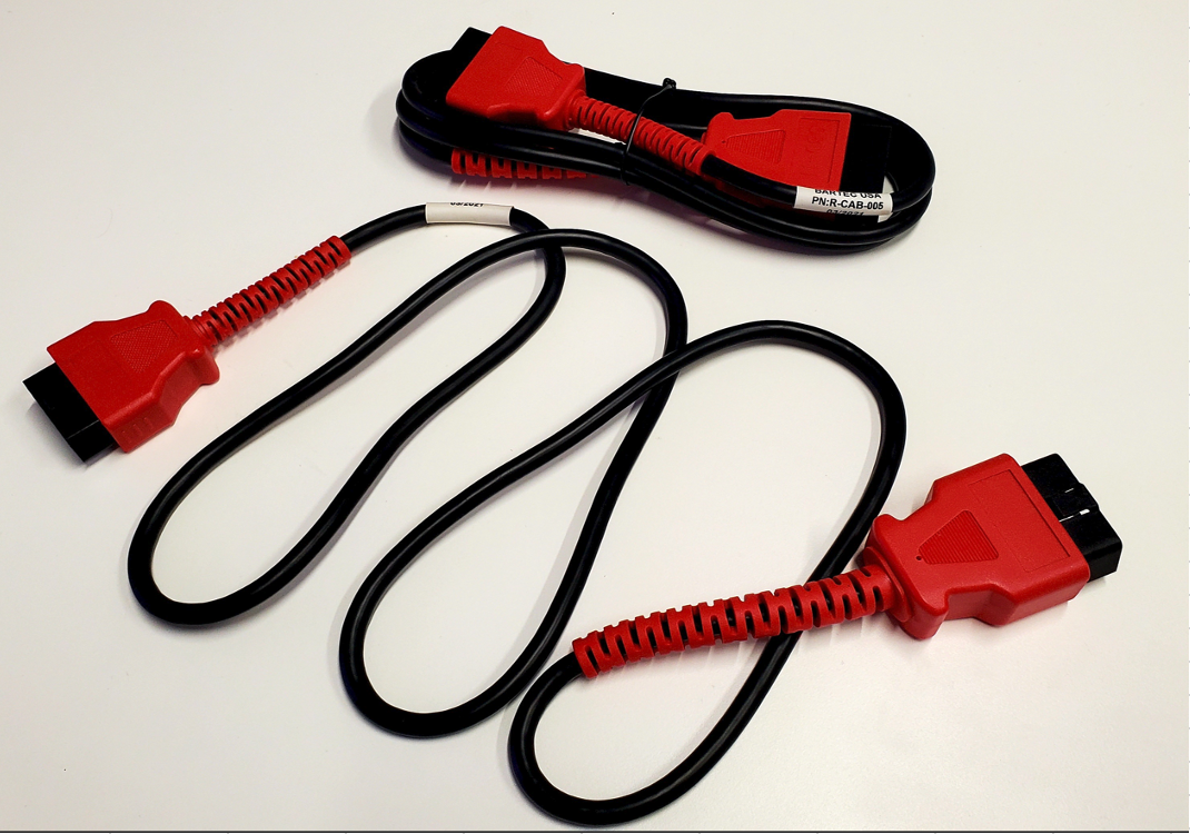 Red and black connector cable with coiled cord and two red plugs on a white background