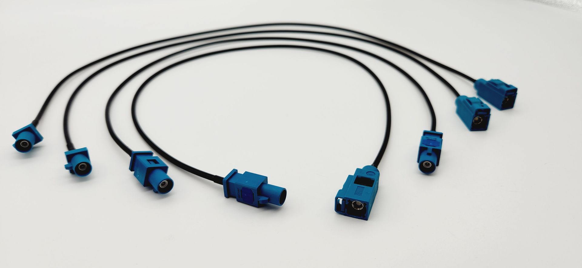 A bunch of blue cables are sitting on a white surface.