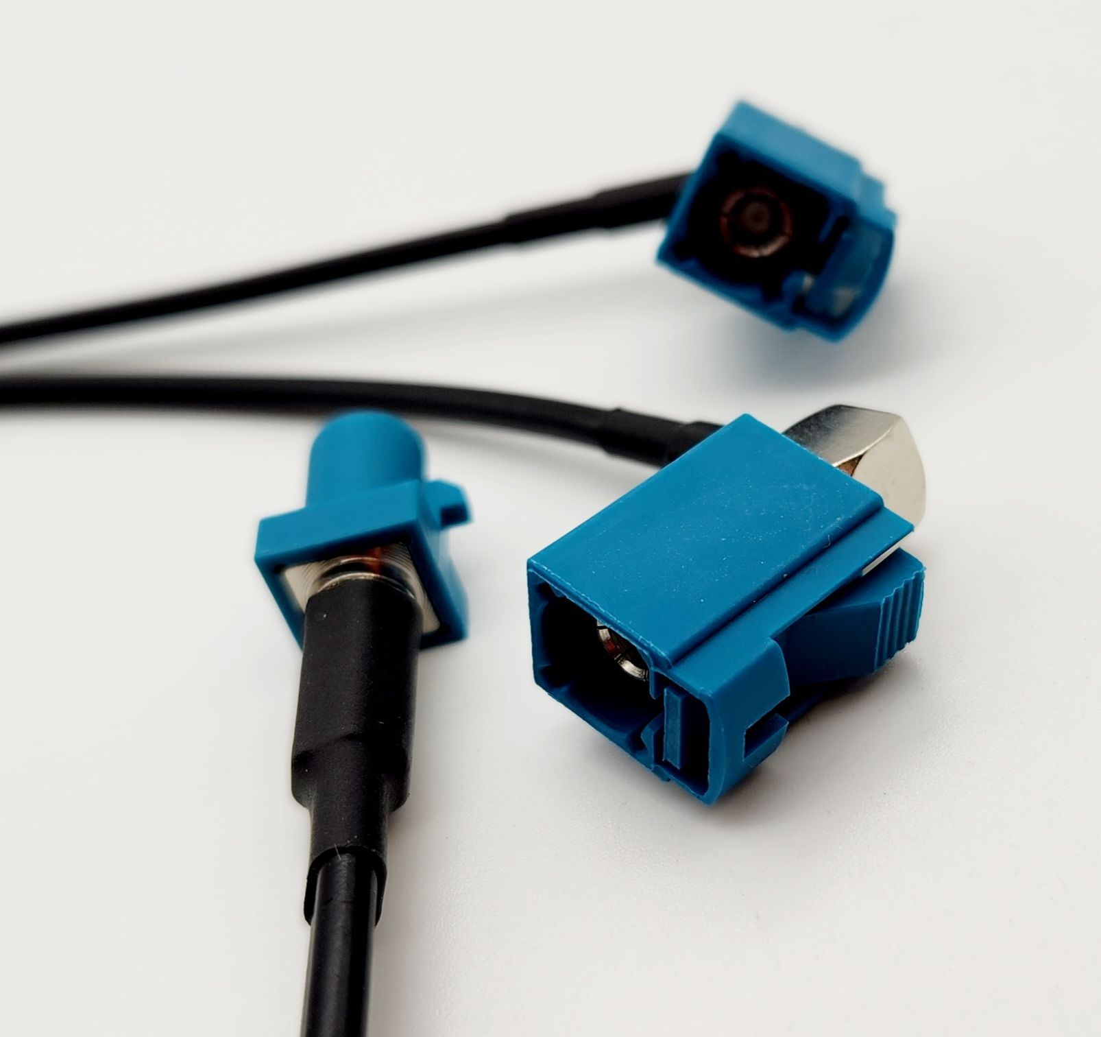 A pair of blue connectors on a white surface