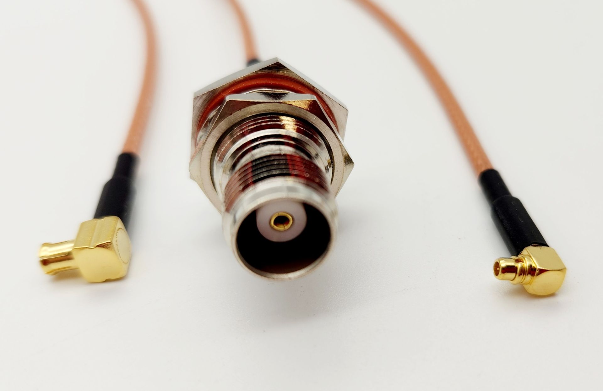A close up of a connector with two cables attached to it