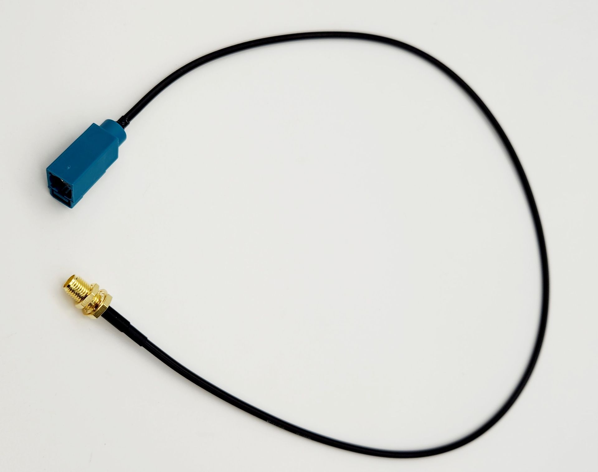 A blue and black cable with a gold connector