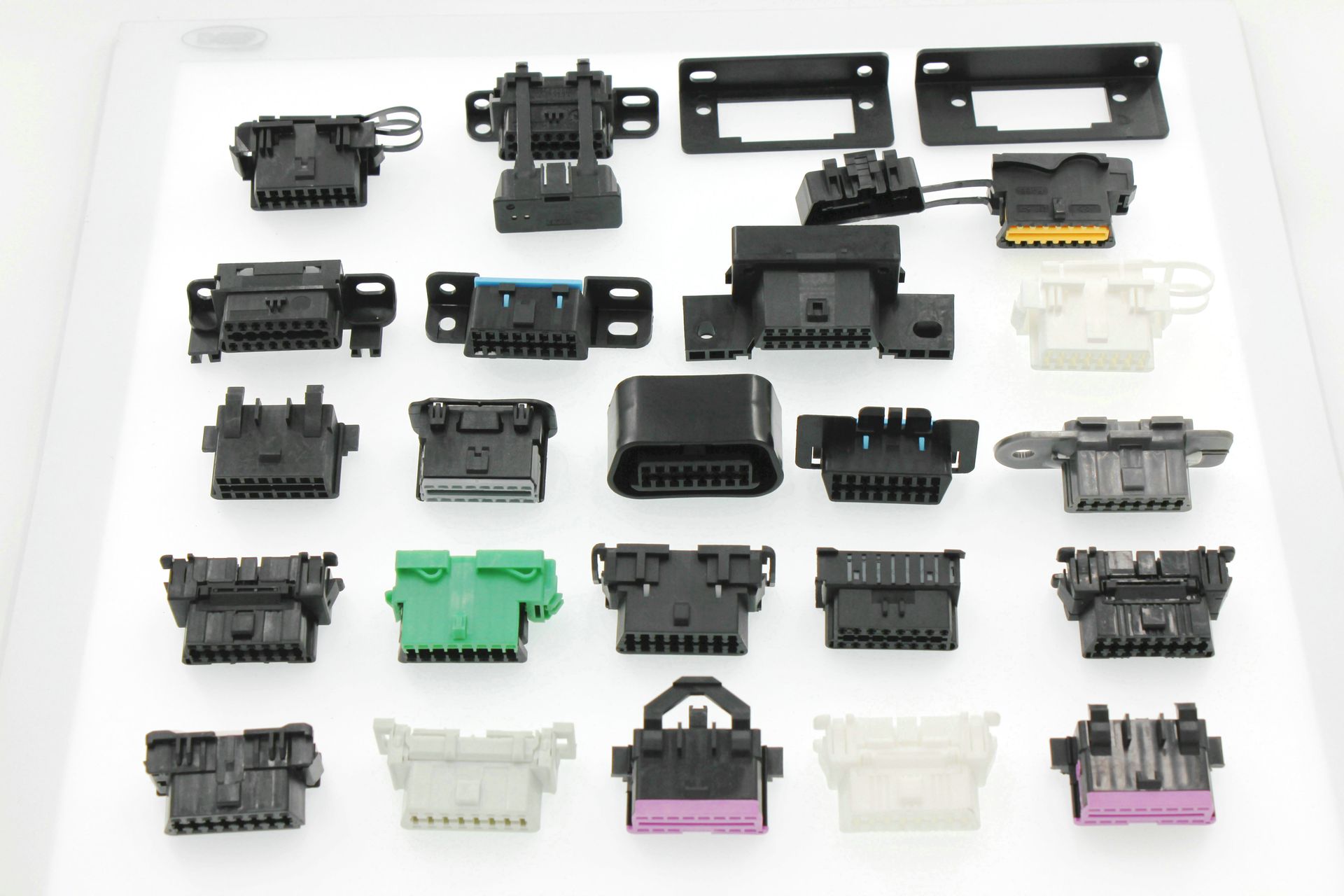 A bunch of different types of connectors on a white surface