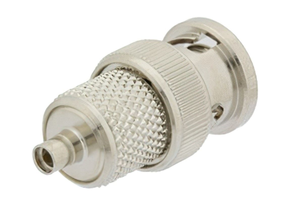 A close up of a metal connector on a white background