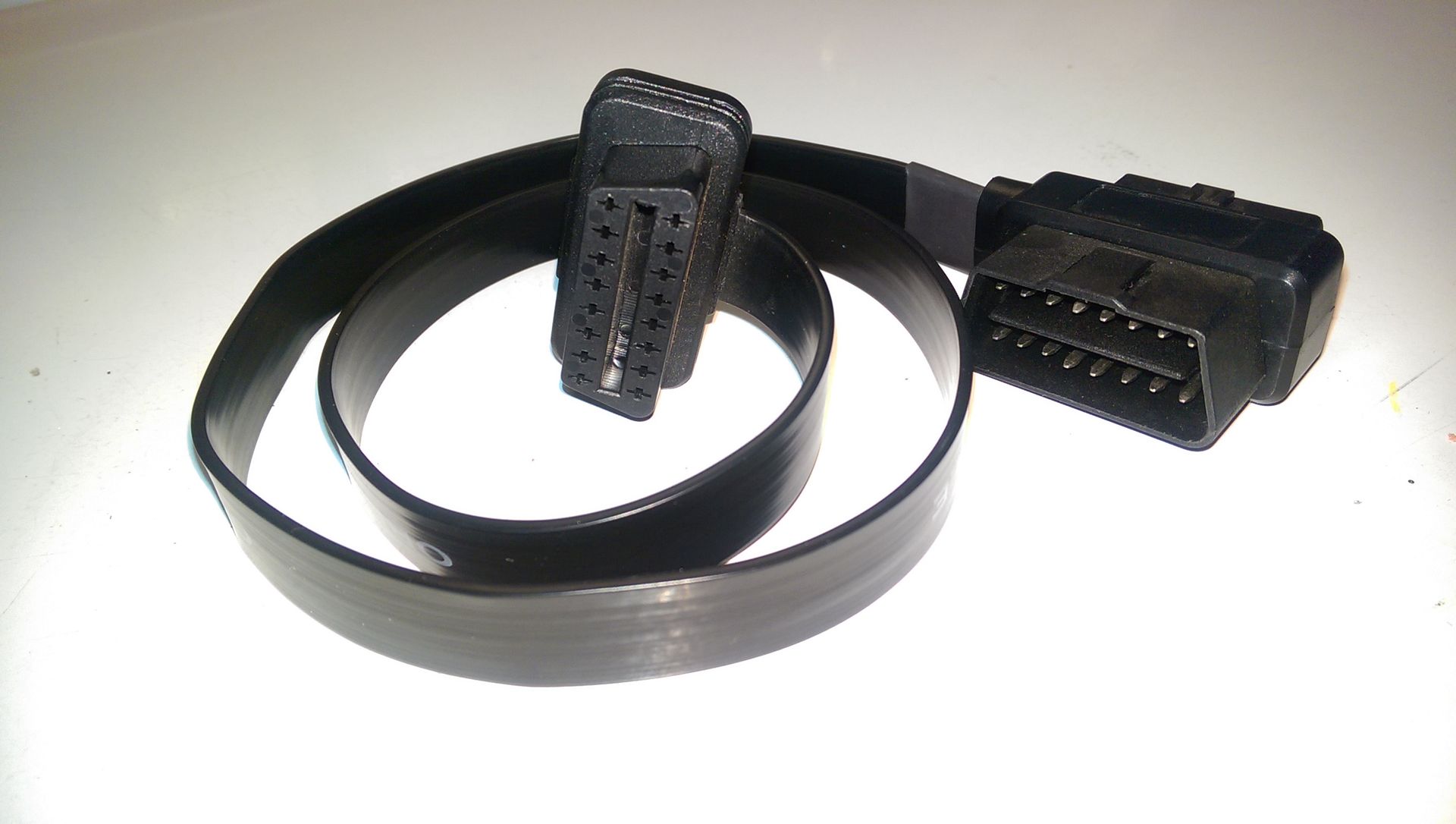 A black cable with a connector on the end