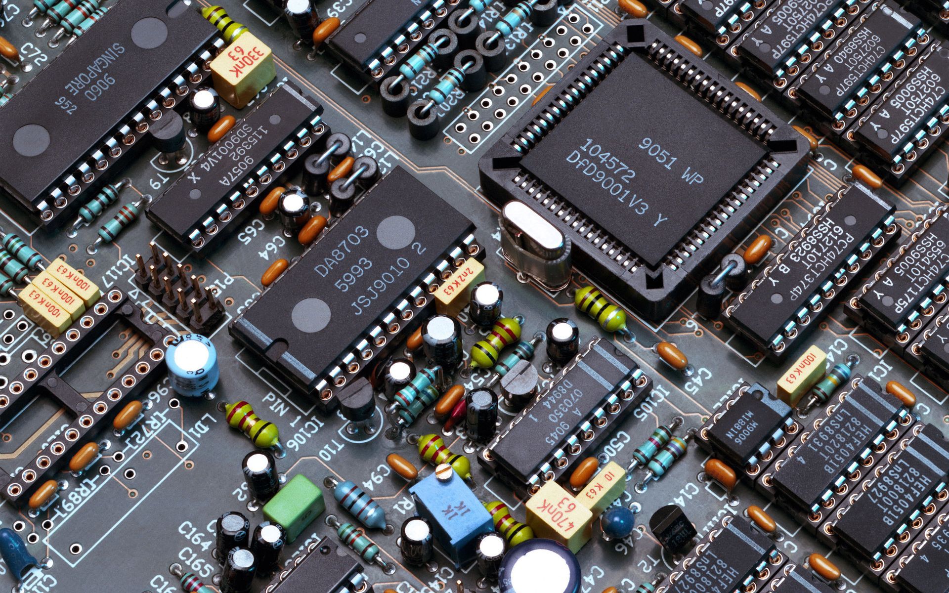 A close up of a circuit board with a chip that says ipod on it