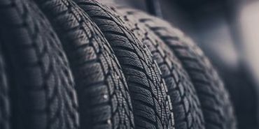 A close up of two tires stacked on top of each other.