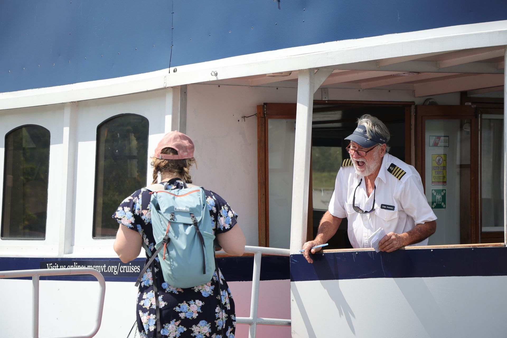Boat captain smiling and greeting a guest.