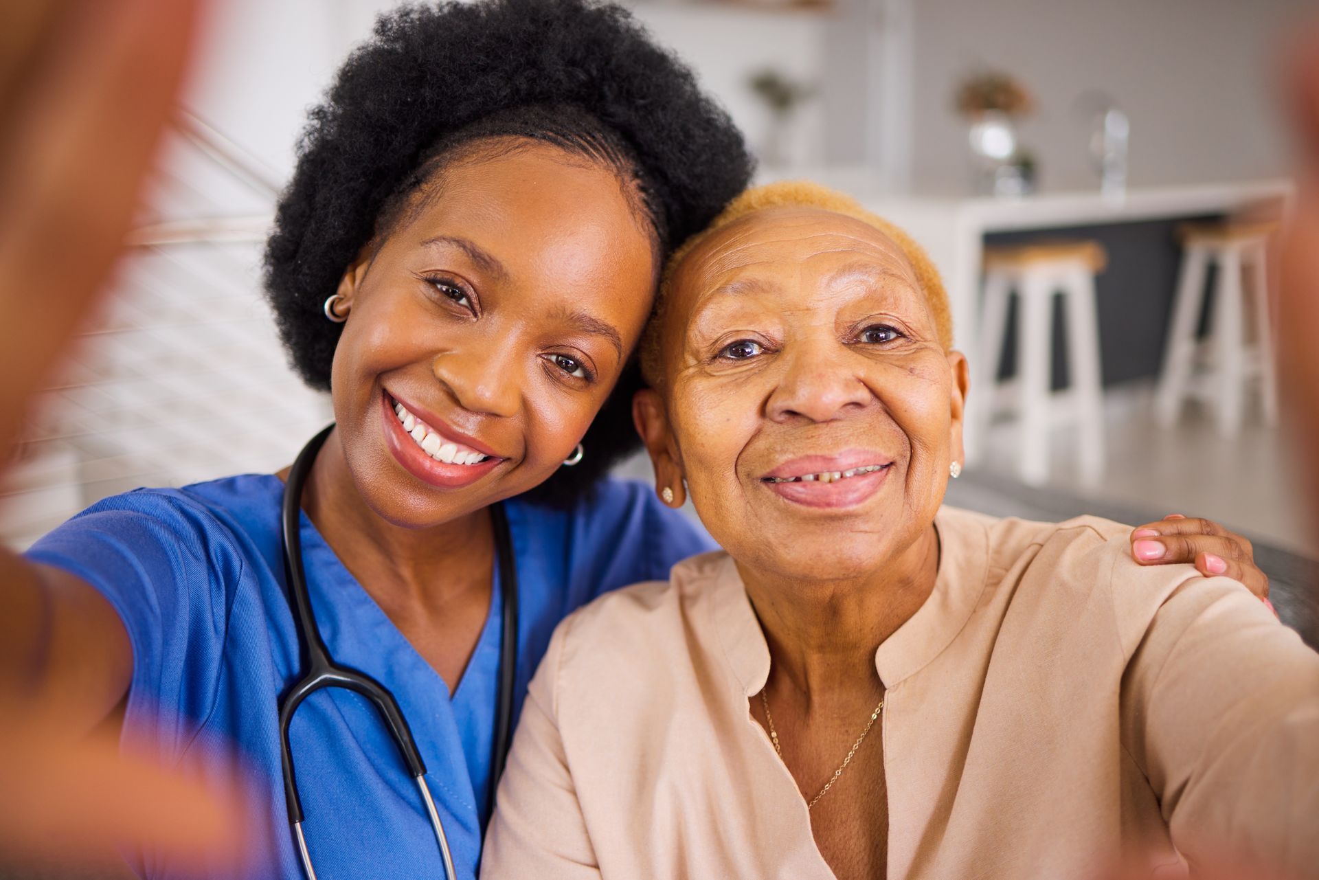 nurse taking picture with old person